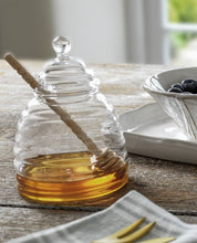 Load image into Gallery viewer, a ridged glass honey pot with a lid. a beech dibber comes with to complete the set, and to drizzle your honey with ease.
