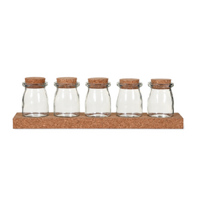 A set of 5 glass storage jars with cork lids and a cork stand