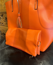Load image into Gallery viewer, A faux leather orange tote bag with tassels and an inner crossbody bag 