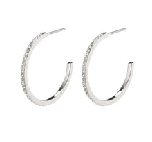 Load image into Gallery viewer, A large open hoop earring, clear crystals encased in polished silver plated metal. With a post fastening to the back.