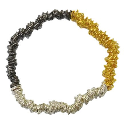 A handmade fairtrade elasticated bracelet. With three colours of metal, silver, gold and dark grey, the bracelet is made up of tiny metal loops intricately attached to an elasticated bracelet which you can just pull onto your wrist, 
