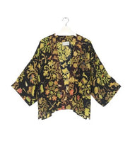 Load image into Gallery viewer, A bestselling kimono from One Hundred Stars in a print, with a black background, and an all over print. Loose 3/4 sleeves and an open front with a lightly embroidered lapel.