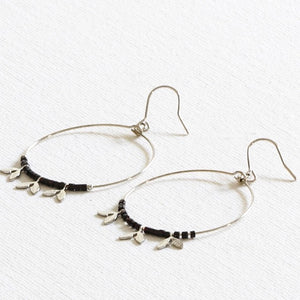 These pretty delicate silver wire hoops have beads and tiny leaves interspersed along the base of the hoop. They make a gorgeous gift and will suit anyone.