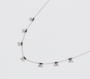 This pretty delicate silver chain necklace has black beads and tiny leaves interspersed along it. It will make a gorgeous gift and will suit anyone.