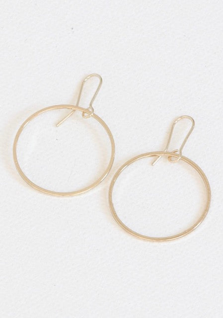 Gold plated 2.5 cm hoop earrings hanging on wire hoops