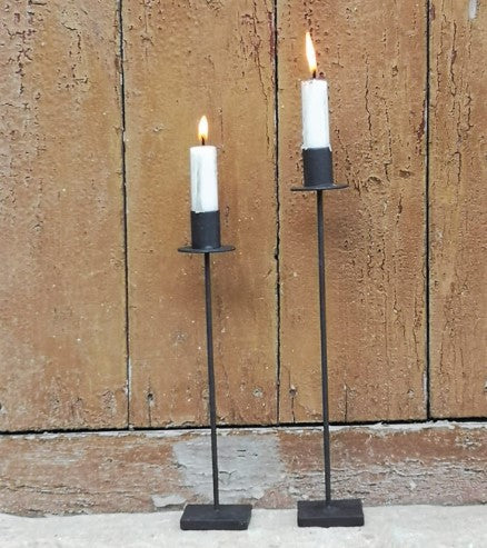 A simple modern candlestick in a rust effect finish. With a square base, the thin stem stands simply to the candle holder. In a rust effect finish. 