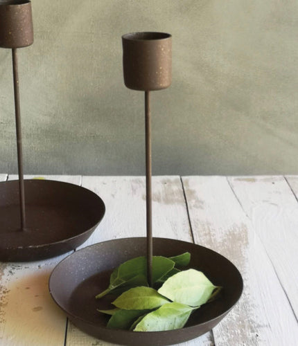 A simple rustic effect candlestick for small monastery candles. It has a dish under it that can be used to add pretty foliage