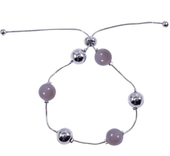 A ladies bracelet featuring silver coloured and semi precious beads to a silver chain. Adjustable fastening. 