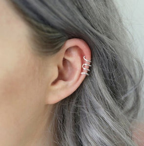 Made from sterling silver plated brass, this ear cuff is a sleek and simple twisted design of a snake. perfect if you do not have a permanent cartillage, simply slip it over your ear. 