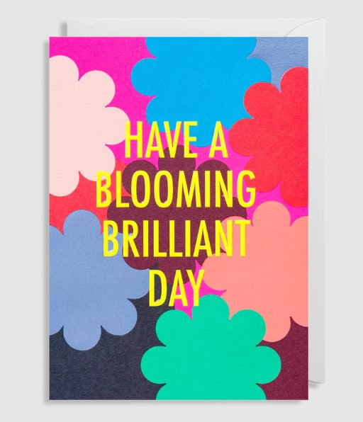 A birthday card with bright modern outlines of flowers to the front. With the words Have a blooming brilliant day to the front. Blank inside. 