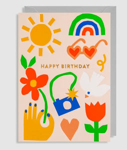 A soft pink background lets do bright and modern graphics of a flower, dove, rainbow, sun and camera do the talking. With the words happy birthday to the front. 