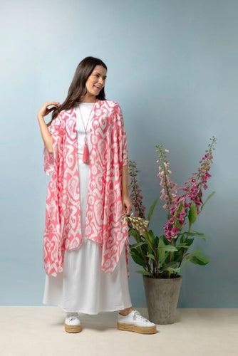 In an Ikat pink print design, this lightweight ladies throwover is delicate in nature. It drapes beautifully and is worn loose. With loose arms and a front which can be tied. 