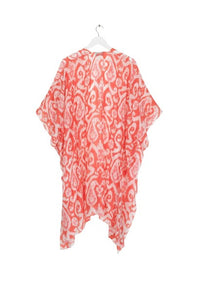 In an Ikat pink print design, this lightweight ladies throwover is delicate in nature. It drapes beautifully and is worn loose. With loose arms and a front which can be tied.
