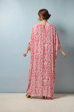 Load image into Gallery viewer, With its bohemian floor-length fit, this kaftan flatters all body shapes – an empire line bust with ¾ length drop shoulder sleeves, V-neck and front subtle gathering that defines your figure without compromising on comfort. In a traditional Ikat pink print.