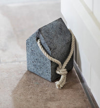 Load image into Gallery viewer, A door stop in the shape of a simple house with a strong hemp rope