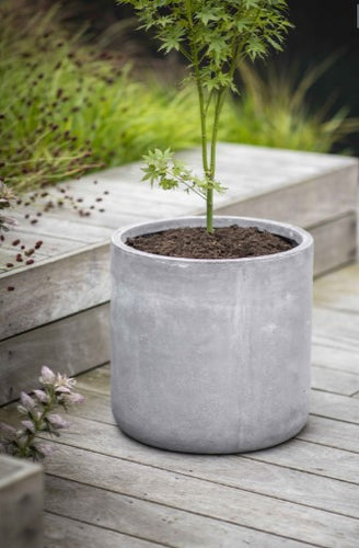 A weatherproof and frostproof grey planter. Minimalist in design in a simple block shape. 
