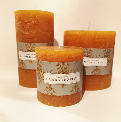 Burnt orange candles in three sizes