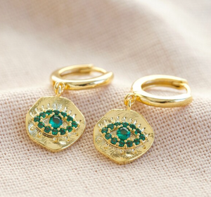 This pair of green gem eye charm earrings are the perfect earring worn alone, or as part of a curated ear look. Gold plated. 