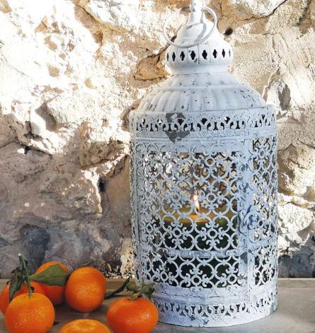 This decorative lantern stands at approximately 38cm tall. The antique white distressed finish is so eye catching. With a clasp closure to the front, you can simply open it up and display your favourite pillar candle inside, or place your favourite plant inside too. With a hook to the top so you have the option to hang it in your favourite spot. 