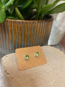 A peridot, a green coloured gemstone, a stone known for its happiness. This semi precious stone is encased in sterling silver, radiating its beauty. With butterfly fastenings to the back.