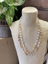 Load image into Gallery viewer, A short style ladies necklace featuring two strands for that layered look. White and gold beads in differing shades and shapes. Clasp adjustable fastening to the back. 