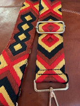Load image into Gallery viewer, A detachable and adjustable bag strap. In a woven aztec design in shades of red, black and a gold toned yellow. With gold hardware. Style up your handbag with your own unique look.