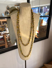 Load image into Gallery viewer, A long ladies necklace, handmade from bamboo beads attached to metal loops to create the long necklace. Wear it as it is, or wrap around to create a shorter necklace. Choose from a selection of colours. Made in Vietnam.