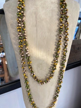 Load image into Gallery viewer, A long ladies necklace, handmade from bamboo beads attached to metal loops to create the long necklace. Wear it as it is, or wrap around to create a shorter necklace. Choose from a selection of colours. Made in Vietnam.