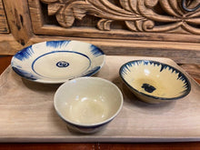 Load image into Gallery viewer, With a diameter of 9.5cm these small dipping bowls are perfect for your sauces and dips. Handmade and hand painted in Vietnam no two are the same. Made from pottery, with a beige cream colour and the design is hand painted on in dark blue.